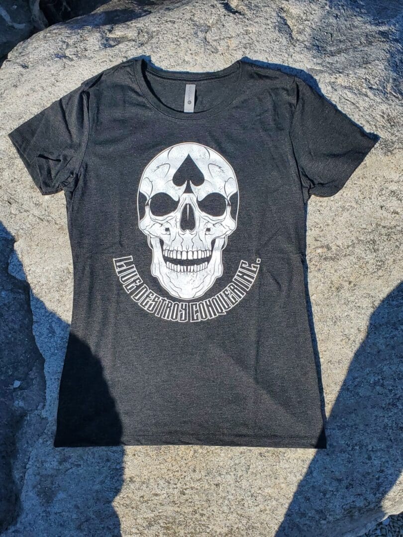 A black t-shirt with a skull on it.