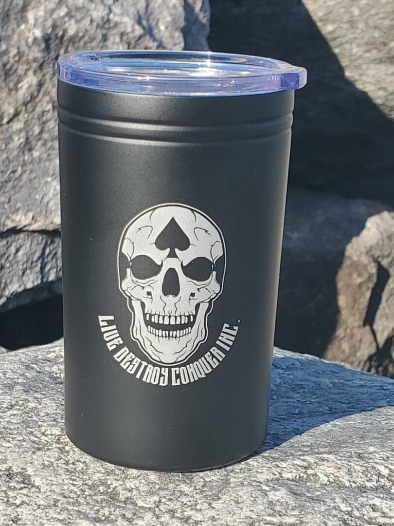 A black cup with a skull on it